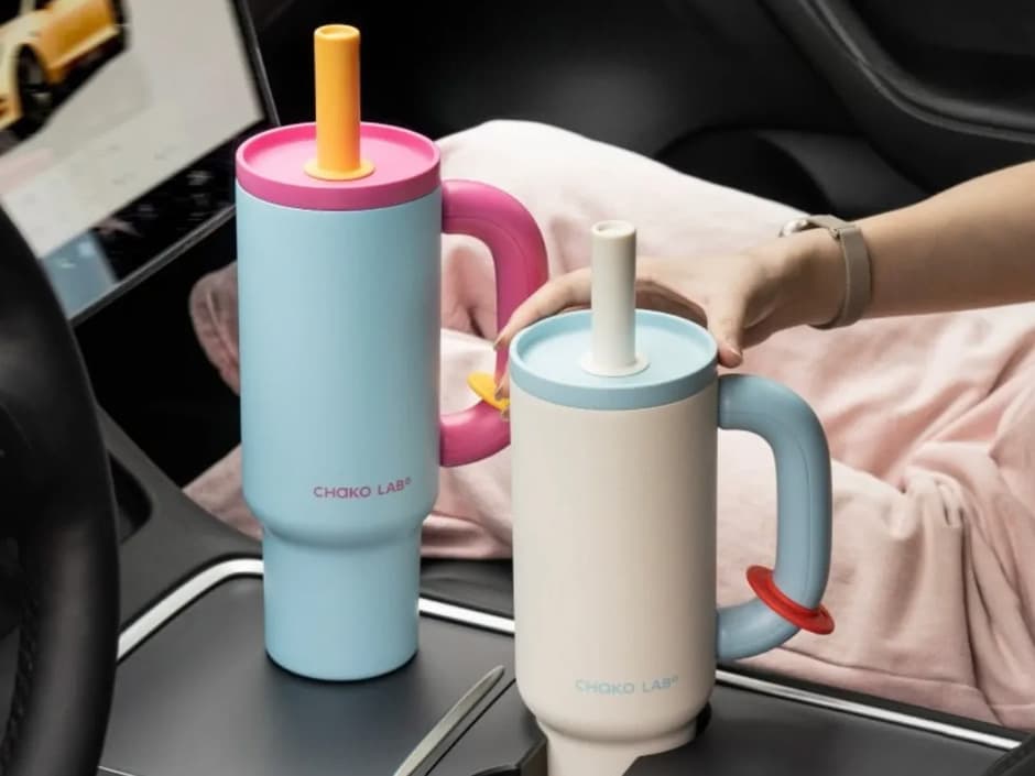 Two Chako Lab tumblers resting in a car cup holder